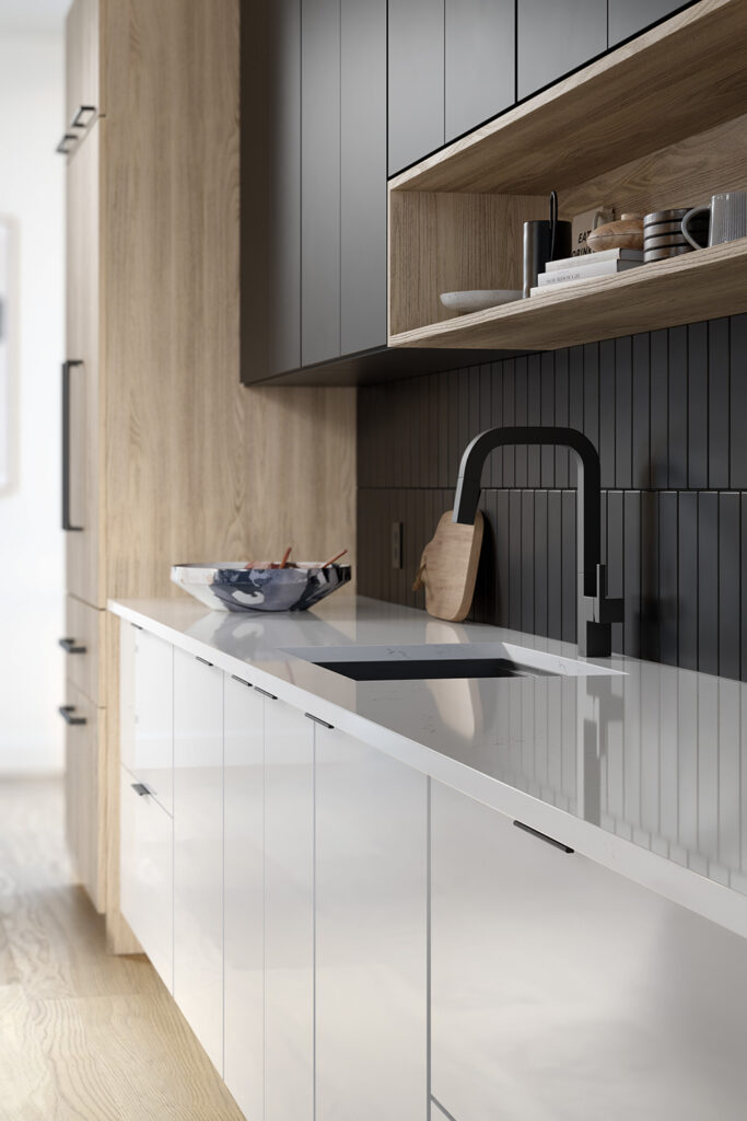Modern kitchen with white lower cabinets, black upper cabinets, and a matte black faucet.