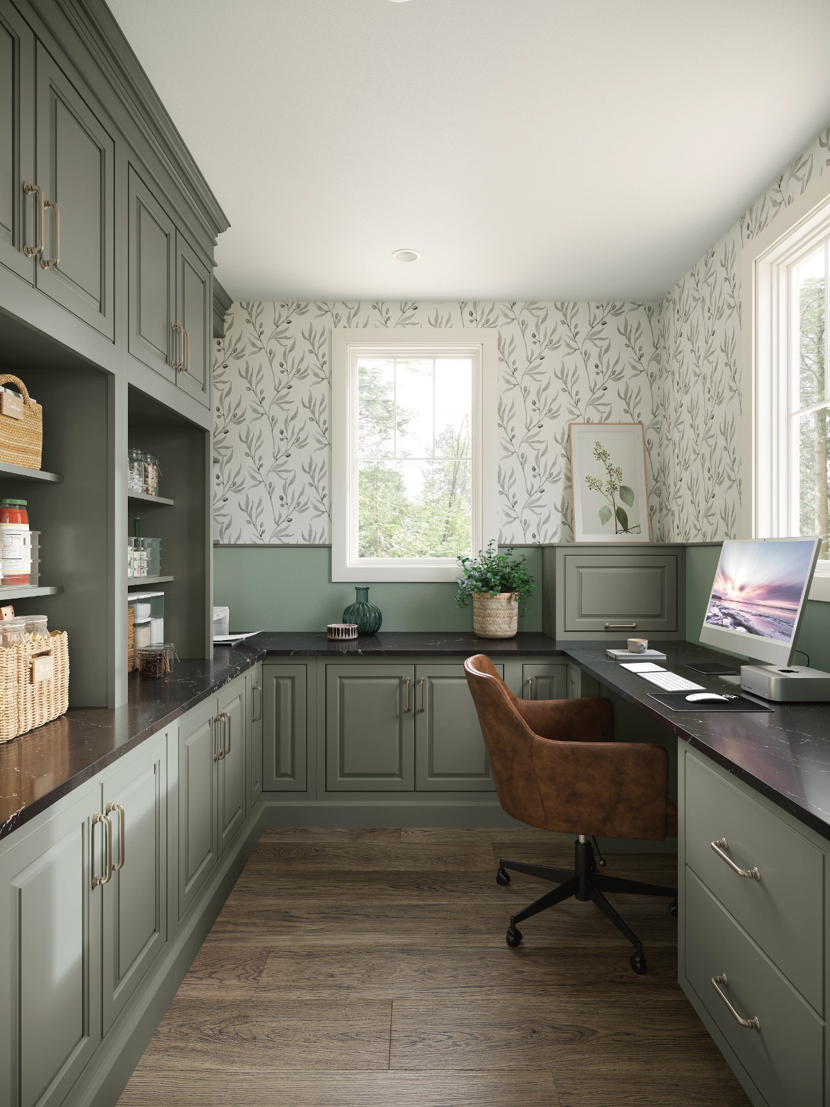 Home office with sage green cabinet brands, a leather chair, and botanical wallpaper.